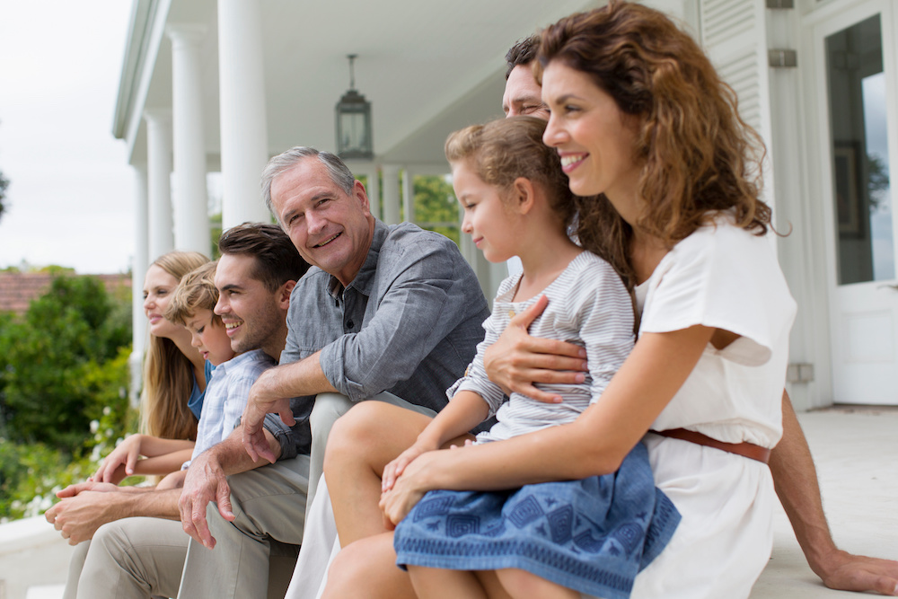 Creating a Tax-Efficient Retirement Strategy: Tips from Financial Experts | Flynn Wealth Partners Portrait happy multi-generation family on patio